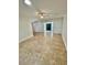 Spacious living area with tile flooring and natural light, featuring decorative fireplace at 2533 E Flower St, Phoenix, AZ 85016