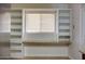 Bright office space featuring built in bookshelves and a window seat with granite countertop and tile floors at 2533 E Flower St, Phoenix, AZ 85016