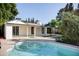 Backyard pool and patio area offering an inviting space for relaxation and entertaining with lush greenery at 2533 E Flower St, Phoenix, AZ 85016