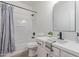 Bathroom with quartz counters, dark hardware, shower-tub combo, and gray accents at 2754 S Sulley Dr # 103, Gilbert, AZ 85295