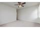 A bright and airy bedroom with a ceiling fan and neutral carpet at 2754 S Sulley Dr # 103, Gilbert, AZ 85295
