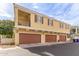 A view of the garages and balcony from the street at 2754 S Sulley Dr # 103, Gilbert, AZ 85295