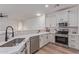 A modern kitchen featuring stainless steel appliances and bright white cabinetry at 2754 S Sulley Dr # 103, Gilbert, AZ 85295