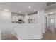Bright, open kitchen featuring stylish white cabinets and modern appliances at 2754 S Sulley Dr # 103, Gilbert, AZ 85295