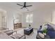 Bright living room with modern furniture, plantation shutters, and a view to the kitchen at 2754 S Sulley Dr # 103, Gilbert, AZ 85295