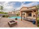 Stunning backyard featuring a pool, gazebo, and fire pit, creating an ideal outdoor living space at 2939 W Sunshine Butte Dr, San Tan Valley, AZ 85144