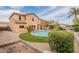 Expansive backyard featuring a pool with a gazebo and desert landscaping at 2939 W Sunshine Butte Dr, San Tan Valley, AZ 85144