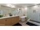 Beautiful bathroom featuring a modern vanity, soaking tub, and glass-enclosed shower at 2939 W Sunshine Butte Dr, San Tan Valley, AZ 85144