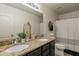 Bathroom featuring a double sink vanity with granite countertops and a shower-tub combination at 2939 W Sunshine Butte Dr, San Tan Valley, AZ 85144