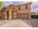 Two story home featuring a two-car garage, neutral color scheme, concrete driveway and tile roof at 2939 W Sunshine Butte Dr, San Tan Valley, AZ 85144