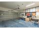 Spacious garage with storage cabinets and shelving providing ample room for parking and organization at 2939 W Sunshine Butte Dr, San Tan Valley, AZ 85144