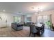 Spacious open-plan living area features updated flooring, natural light, and contemporary decor at 2939 W Sunshine Butte Dr, San Tan Valley, AZ 85144
