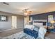 Gorgeous main bedroom features statement wall, comfortable linens, and an accent bench at 2939 W Sunshine Butte Dr, San Tan Valley, AZ 85144