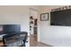 Contemporary office space showing built-in desk, dual monitors and view to another room at 2939 W Sunshine Butte Dr, San Tan Valley, AZ 85144