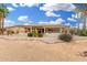 Serene backyard featuring a covered patio, desert landscaping, and picturesque views of the surrounding area at 3150 N 150Th Dr, Goodyear, AZ 85395