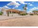 Charming covered patio offers a relaxing outdoor space with desert landscaping at 3150 N 150Th Dr, Goodyear, AZ 85395