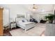 Spacious bedroom with hardwood floors, a ceiling fan, and plenty of natural light at 3150 N 150Th Dr, Goodyear, AZ 85395