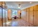 Versatile bonus room with ample storage cabinets, a workspace area, and bright natural light at 3150 N 150Th Dr, Goodyear, AZ 85395