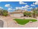Beautiful single-Gathering home with manicured landscaping, rock features, and a spacious three-car garage at 3150 N 150Th Dr, Goodyear, AZ 85395