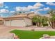 Beautiful single-Gathering home with manicured landscaping, rock features, and a spacious three-car garage at 3150 N 150Th Dr, Goodyear, AZ 85395