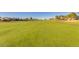 Wide shot of the beautiful golf course with a blue sky at 3150 N 150Th Dr, Goodyear, AZ 85395