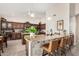Spacious kitchen with custom cabinets, granite countertops, and a large center island with seating at 3150 N 150Th Dr, Goodyear, AZ 85395