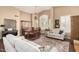 Inviting living room with elegant furnishings, a dining area, and beautiful natural light at 3150 N 150Th Dr, Goodyear, AZ 85395
