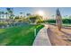 Inviting community tennis courts, surrounded by lush greenery and mature trees at 3150 N 150Th Dr, Goodyear, AZ 85395