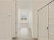 Modern bathroom with a glass shower, soaking tub, and tiled floors at 37325 W San Clemente St, Maricopa, AZ 85138