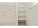 Bright bathroom featuring a shower-tub combo and built-in shelving at 37325 W San Clemente St, Maricopa, AZ 85138