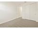 Carpeted bedroom with a window, a closet, and an open door at 37325 W San Clemente St, Maricopa, AZ 85138