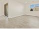 Bright bedroom with large window and tile flooring at 37325 W San Clemente St, Maricopa, AZ 85138
