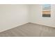 Bright bedroom with neutral carpet, window at 37325 W San Clemente St, Maricopa, AZ 85138
