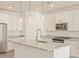 Bright kitchen featuring granite countertops, stainless steel appliances, and pendant lighting at 37325 W San Clemente St, Maricopa, AZ 85138