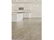 Tile flooring extending throughout a kitchen with modern appliances at 37325 W San Clemente St, Maricopa, AZ 85138