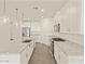 Spacious kitchen showcasing stainless steel appliances, a large island, and ample cabinet space at 37325 W San Clemente St, Maricopa, AZ 85138