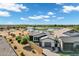 Aerial view of a stylish home, showcasing the beautiful landscaping and stunning views of the nearby pond and golf course at 3842 E Alameda Ln, Gilbert, AZ 85298