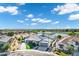 Stunning aerial view of a modern single-Gathering home with lush landscaping, a lake view, and a well-manicured lawn at 3842 E Alameda Ln, Gilbert, AZ 85298