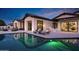 Inviting backyard featuring a swimming pool, lounge chairs, and a covered patio for outdoor entertaining and relaxation at 3842 E Alameda Ln, Gilbert, AZ 85298