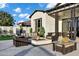 Cozy outdoor living area with a fire pit and comfortable seating under the blue sky at 3842 E Alameda Ln, Gilbert, AZ 85298
