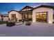 Inviting backyard with a fire pit, patio seating, and scenic views at sunset at 3842 E Alameda Ln, Gilbert, AZ 85298