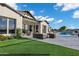Spacious backyard with a pool, outdoor seating, and artificial grass, creating a perfect oasis at 3842 E Alameda Ln, Gilbert, AZ 85298