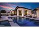 Stunning backyard pool and patio area with chaise lounges perfect for relaxing and enjoying the outdoors at 3842 E Alameda Ln, Gilbert, AZ 85298