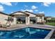 Exterior of home showcasing a pool, large patio, and sliding glass doors to the interior at 3842 E Alameda Ln, Gilbert, AZ 85298