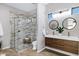 Bright bathroom featuring a dual vanity, walk-in shower, and modern fixtures at 3842 E Alameda Ln, Gilbert, AZ 85298