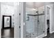 Beautiful bathroom featuring a glass shower with stylish tile, seating, and a convenient shampoo niche at 3842 E Alameda Ln, Gilbert, AZ 85298