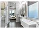Luxurious bathroom featuring a soaking tub, standalone shower, and modern fixtures at 3842 E Alameda Ln, Gilbert, AZ 85298