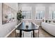 Dining area featuring a large table, stylish chairs, and bright windows at 3842 E Alameda Ln, Gilbert, AZ 85298