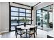 Dining area featuring a large glass window and glass door that offers plenty of natural light and an outdoor view at 3842 E Alameda Ln, Gilbert, AZ 85298