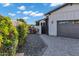 View of the gray driveway and flowers in the landscaping at 3842 E Alameda Ln, Gilbert, AZ 85298
